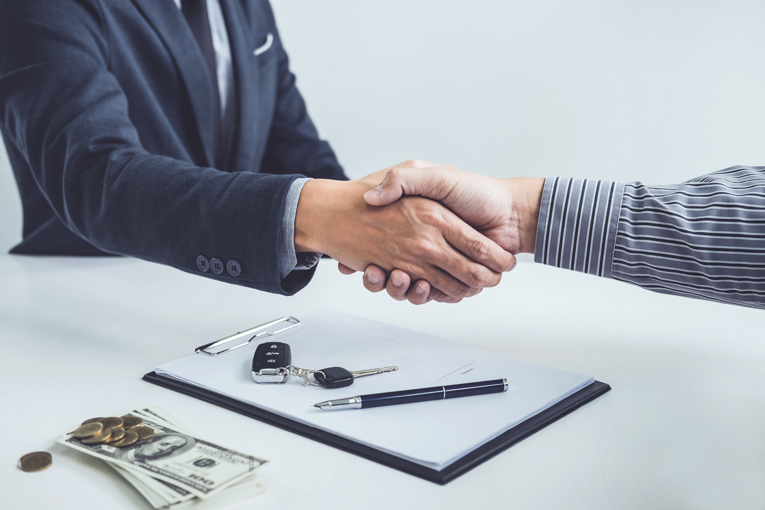 Handshake of cooperation customer and salesman after agreement,