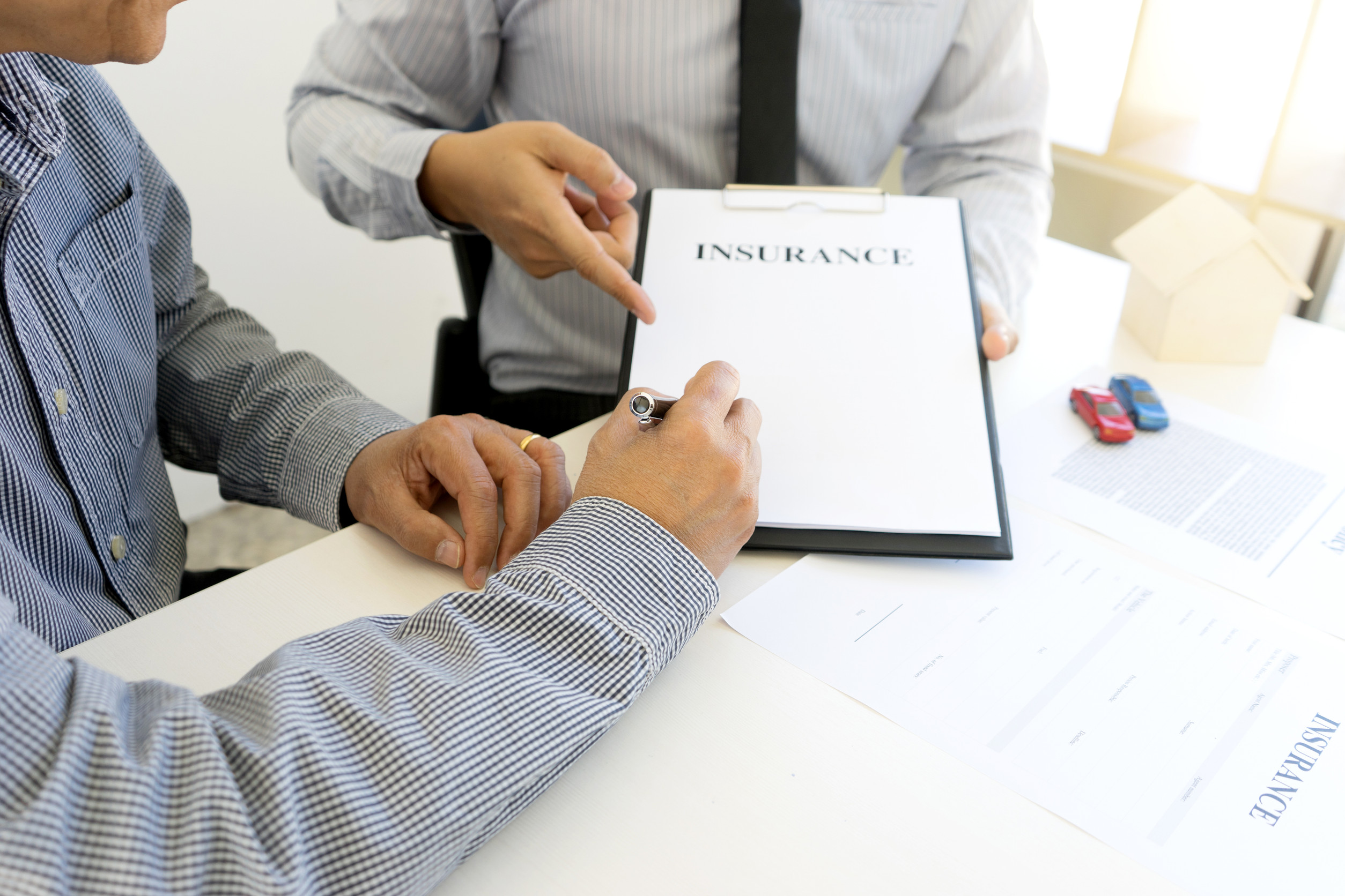 Young Business man insurance agent show document contract
