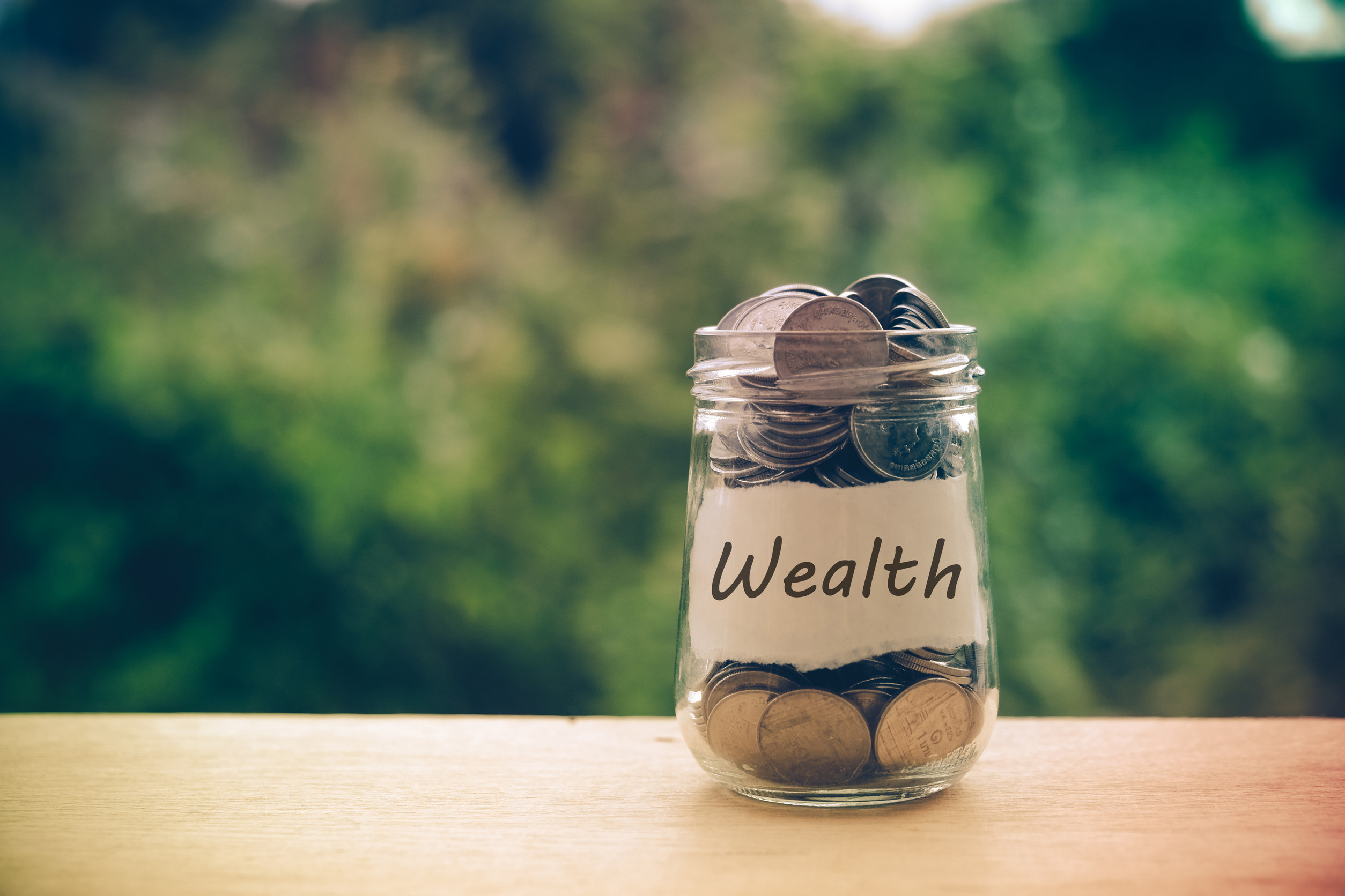 save money for investment concept money in the glass with filter